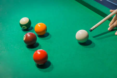Billiard balls on pool green table - sport background