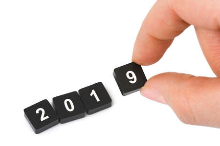 Numbers 2019 and hand isolated on white background