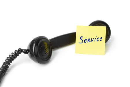 Vintage telephone and paper Service isolated on white backgroundの写真素材