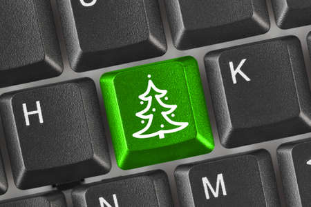 Computer keyboard with Christmas tree keyの写真素材