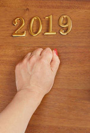 Hand and numbers 2019 on door - new year concept backgroundの写真素材
