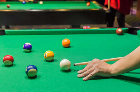 Billiard balls on pool green table - sport background