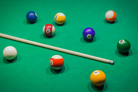Billiard balls on pool green table - sport background