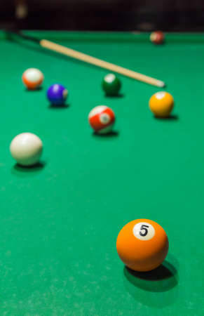 Billiard balls on pool green table - sport background