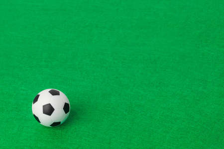 Soccer ball on football field - sport backgroundの写真素材