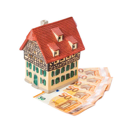 House and money euro isolated on white backgroundの写真素材