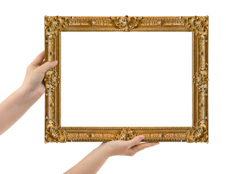 Wooden picture frame in hands isolated on white background
