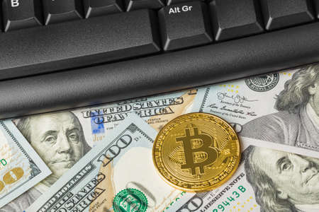 Computer and bitcoins on money - business technology backgroundの写真素材