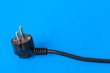 Electrical plug - blue background
