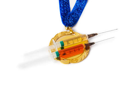 Gold medal and syringes isolated on white backgroundの写真素材