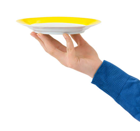 Hand with plate isolated on white backgroundの写真素材