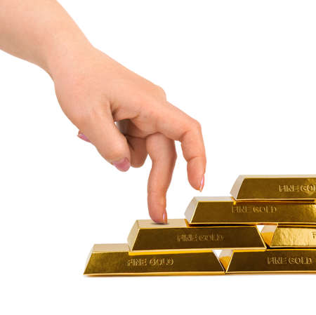 Hand and stairs made of gold bars isolated on white backgroundの写真素材