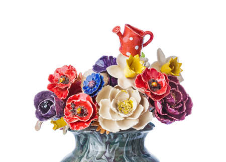 Ceramic decorative flowers bouquet in vase isolated on white backgroundの写真素材