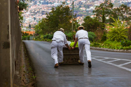 Toboggan riders on sledge in Monte - Funchal Madeira island - Portugalの写真素材