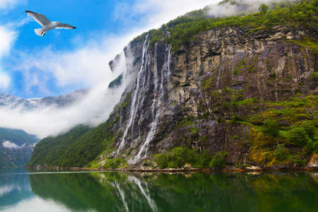 Waterfall in Geiranger fjord Norway - nature and travel backgroundの写真素材