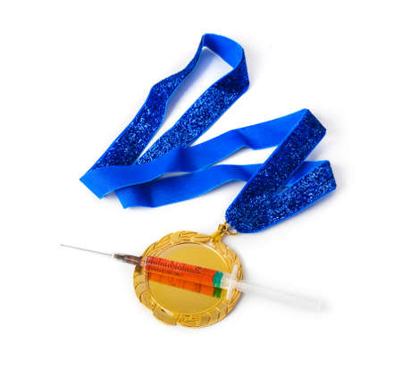 Gold medal and syringe isolated on white backgroundの写真素材