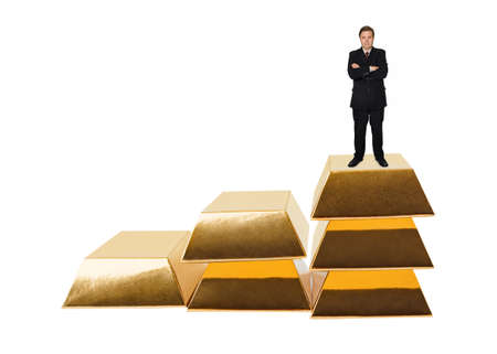 Businessman and stairs made of gold bars isolated on white backgroundの写真素材