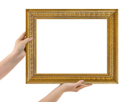 Wooden picture frame in hands isolated on white backgroundの写真素材