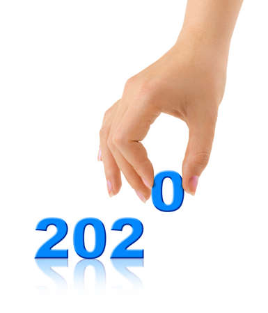 Numbers 2020 and hand isolated on white background