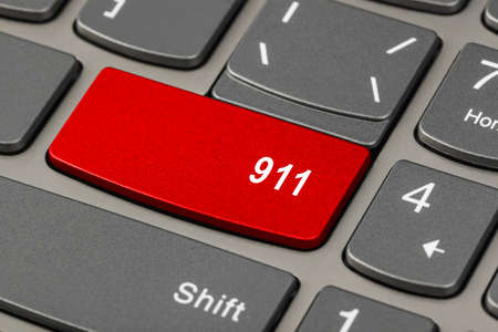 Computer keyboard with 911 key - technology backgroundの写真素材