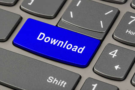Computer notebook keyboard with Download key - technology backgroundの写真素材