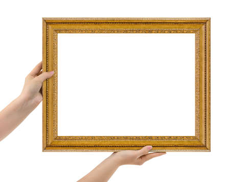 Wooden picture frame in hands isolated on white backgroundの写真素材