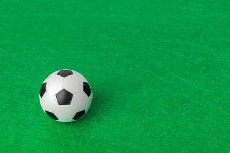 Soccer ball on football field - sport backgroundの写真素材