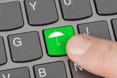 Computer keyboard with umbrella key - technology background