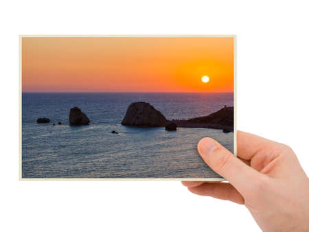 Hand and Aphrodite rock at sunset - Paphos Cyprus (my photo) isolated on white backgroundの写真素材