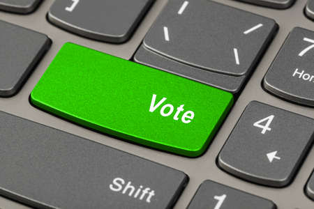 Computer notebook keyboard with Vote key - technology backgroundの写真素材
