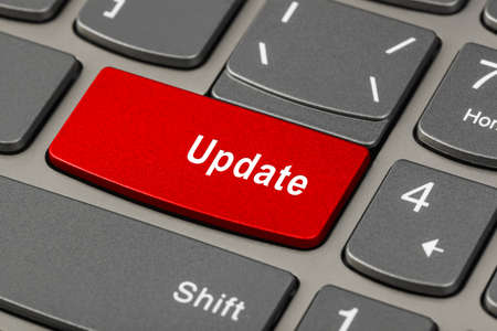 Computer notebook keyboard with Update key - technology background