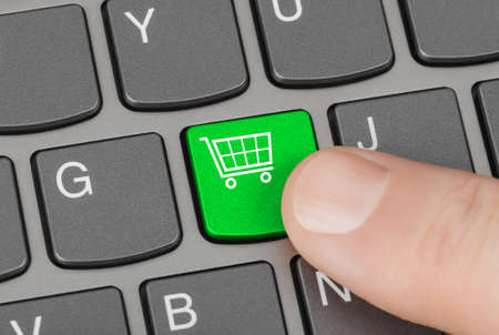 Computer keyboard with shopping key - internet conceptの写真素材