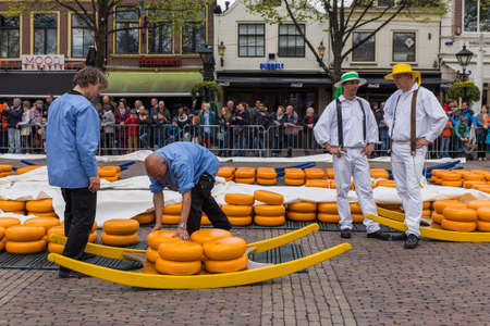 Alkmaar, Netherlands - April 28, 2017: Cheese carriers at traditional cheese market.のeditorial素材