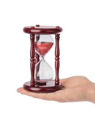 Hand with hourglass isolated on white background