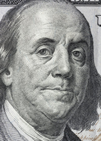 Portrait of Benjamin Franklin on a 100 dollars bill - business backgroundのeditorial素材
