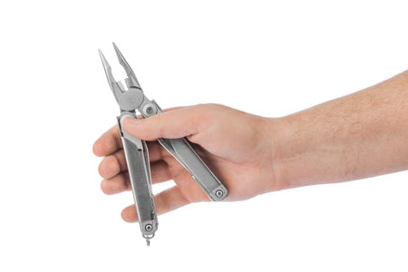 Multitool in hand isolated on white background