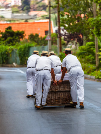 Toboggan riders on sledge in Monte - Funchal Madeira island - Portugalの写真素材