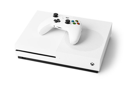 Moscow, Russia - April 18, 2019: Wireless gamepad and Xbox console - isolated on white background.のeditorial素材