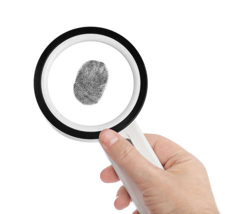 Magnifying glass in hand and fingerprint isolated on white backgroundの写真素材
