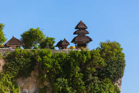 Uluwatu temple in Bali Indonesia - nature and architecture backgroundの写真素材