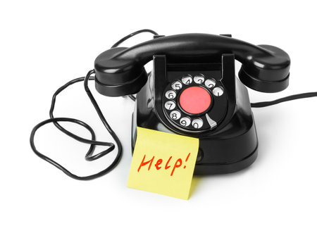 Vintage telephone and paper Help isolated on white backgroundの写真素材
