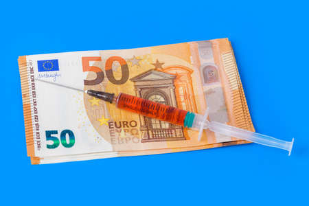 Syringe and euro money - business and medical backgroundの写真素材