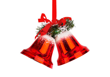 Christmas bells with a red bow isolated on white backgroundの写真素材