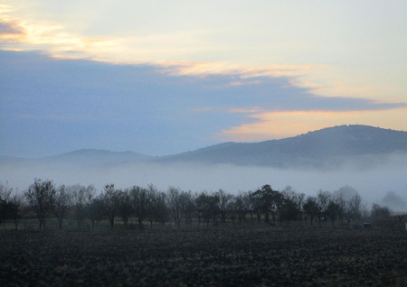 Cloudy and misty landscapeの写真素材