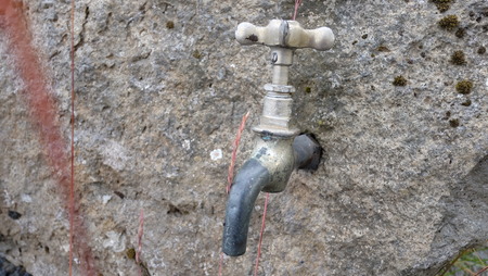 faucet on stoneの写真素材