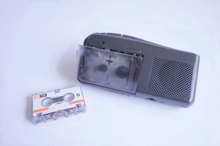 Old cassette tape player on whiteの写真素材