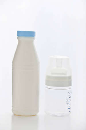 comparison of milk bottle in white backgroundの写真素材