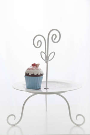 Ceramic cup cake on dishの写真素材