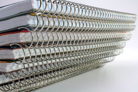 Spirals of writing-books for record, are placed so that to create a background.の写真素材