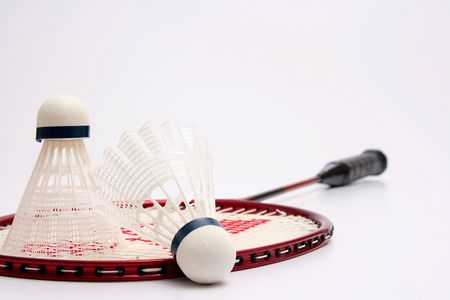 White shuttlecocks for badminton and a racket.の写真素材